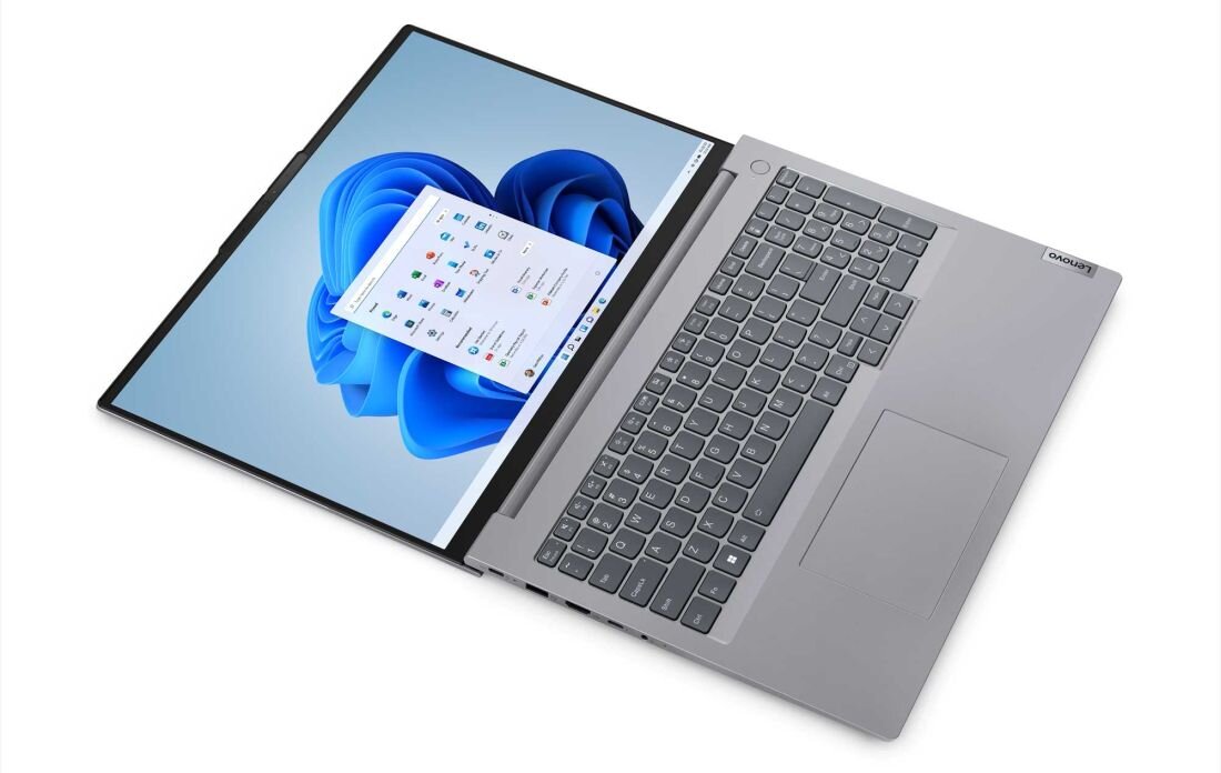 Laptop LENOVO ThinkBook 16 - laptop Lenovo w metalicznym szarym kolorze z dużym ekranem, cienkimi ramkami, pełnowymiarową klawiaturą z blokiem numerycznym, wyświetlający system Windows 11.